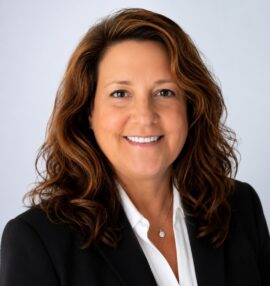 Kathy Lafon's headshot. She is wearing a white blouse and a black jacket.