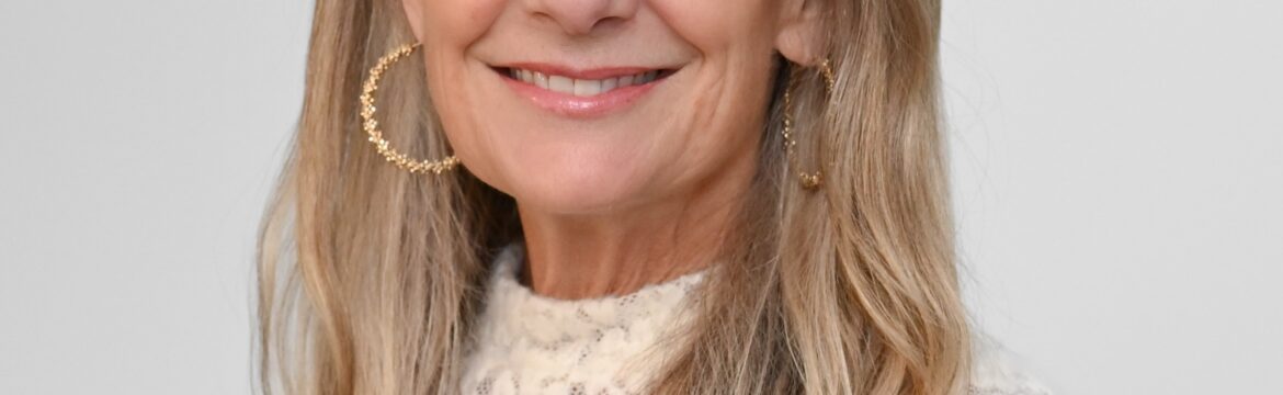 Prenter Mosey headshot, wearing a white lace turtleneck, white background