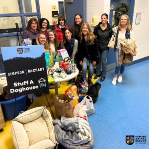 The Simpson-McCrady team with the items donated to the Stuff a Doghouse Drive