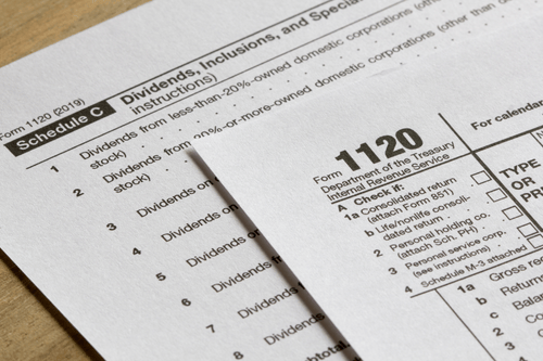 An 1120 tax form representing the tax liability insurance Simpson McCrady provides clients.