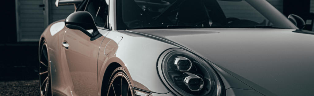 A porsche at sunset in a driveway. Simpson McCrady Protecting High-Net-Worth Assets in an Evolving Risk Landscape: 2025 Trends.
