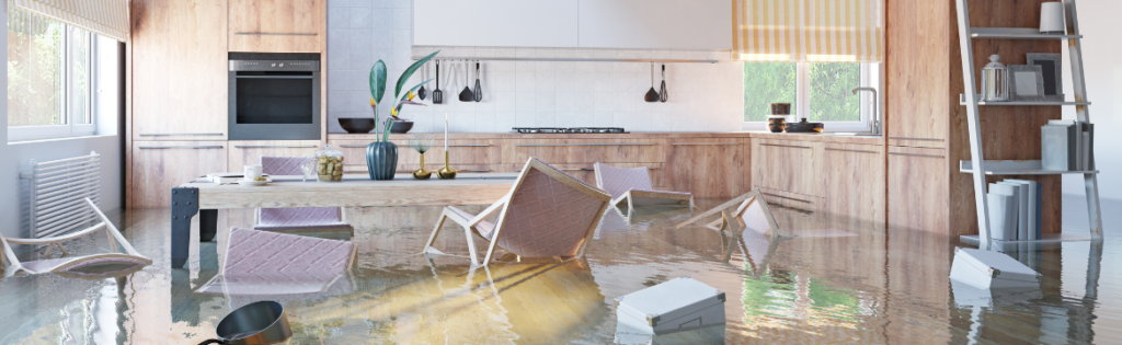 Flooded luxury home kitchen. Simpson McCrady Protecting High-Net-Worth Assets in an Evolving Risk Landscape: 2025 Trends.
