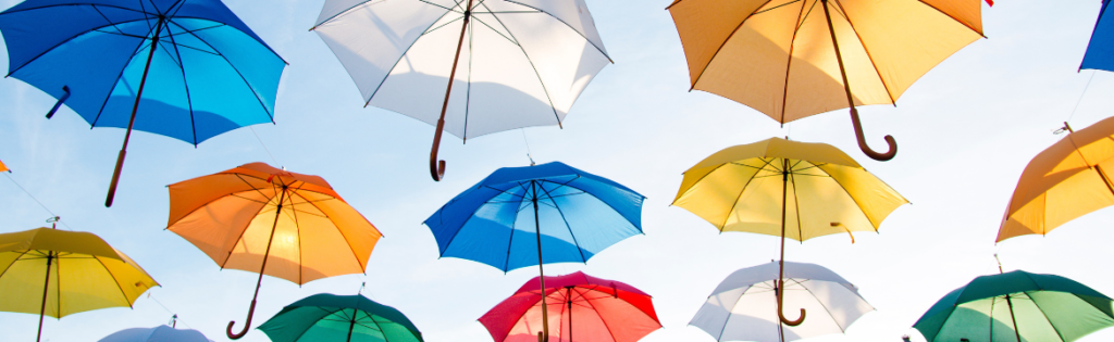 Umbrellas floating in the sky. Simpson McCrady Protecting High-Net-Worth Assets in an Evolving Risk Landscape: 2025 Trends.