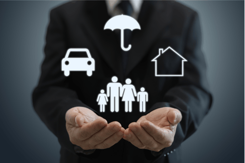 Image of an executive with palms open and four white icons float above: umbrella, home, family, and car. It represents personal umbrella insurance coverage. Simpson McCrady.