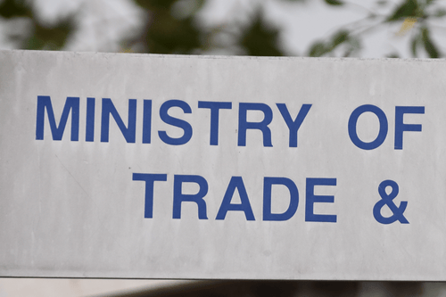 Sign the reads Ministry of Trade representing Political Risk Insurance. Simpson McCrady.